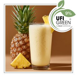 Egzotyczny drink z ananasem na tle brzoskwiniowym.