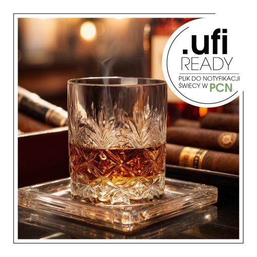 Szklanka whiskey i cygaro leżące na stole.
